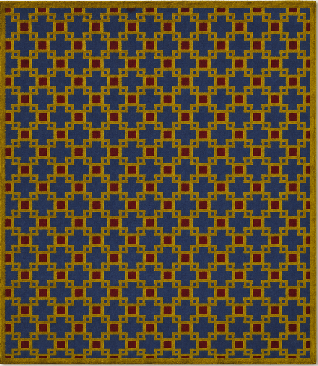 Tapis rectangulaire Soren – motif géométrique entrelacé – bleu profond, ocre et rouge brique