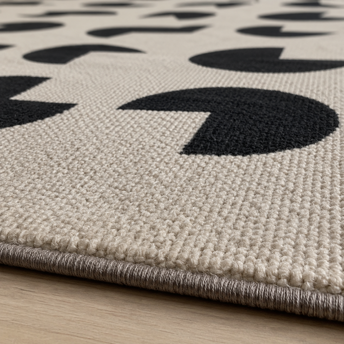 Tapis rectangulaire Paco – motifs géométriques arrondis – écru et noir profond
