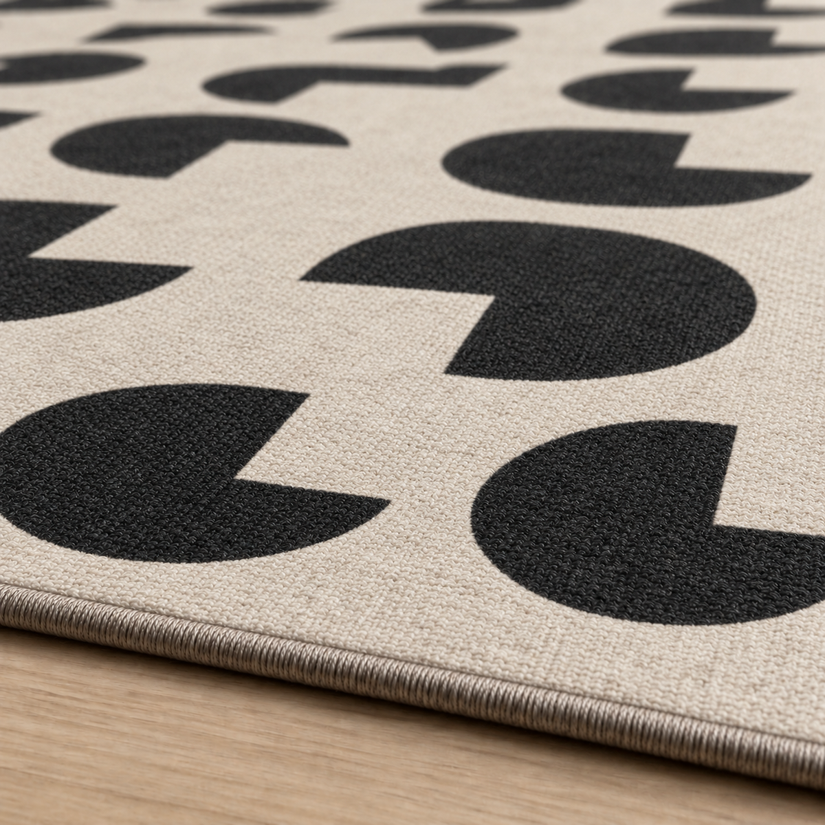 Tapis rectangulaire Paco – motifs géométriques arrondis – écru et noir profond